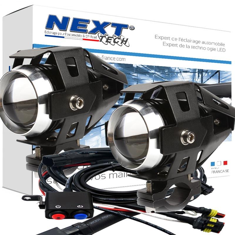 Kit de feux LED additionnels conçus pour moto, de marque Next Tech Swiss, avec projecteurs noirs et câblages inclus dans l'emballage.