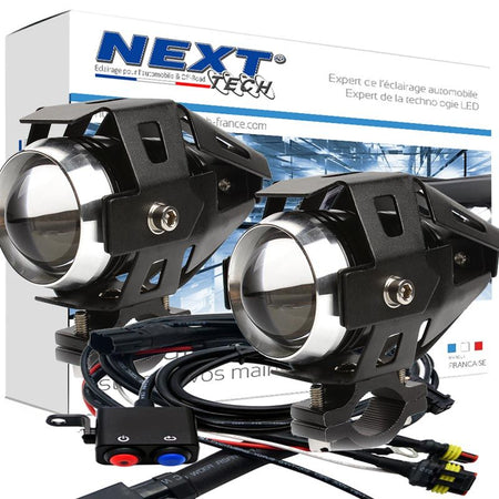 Kit de feux LED additionnels conçus pour moto, de marque Next Tech Swiss, avec projecteurs noirs et câblages inclus dans l'emballage.